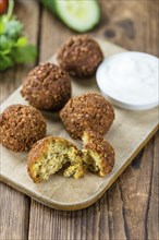 Wooden table with Falafels (close-up shot, selective focus)