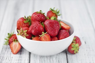 Strawberries on a vintage background as detailed close-up shot, selective focus