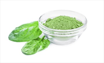 Spinach powder isolated on white background (close up, selective focus)