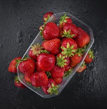 Strawberries on a vintage background as detailed close-up shot, selective focus