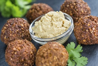 Wooden table with Falafels (close-up shot, selective focus)