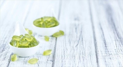 Portion of gummy candy (with lime taste) as close-up shot (selective focus)