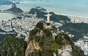 Cristo Redentor statue in Rio de Janeiro (aerial shot made from a helicopter) during a spectacular