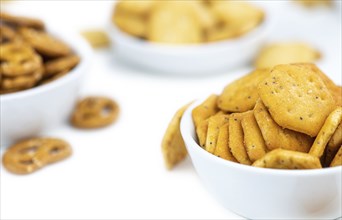 Portion of mixed Snacks isolated on white background (close up shot, selective focus)