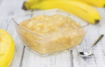 Banana Mash (close-up shot) on a vintage wooden table (selective focus)