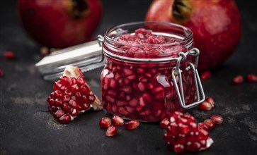 Some fresh preserved Pomegranate seeds (selective focus, close-up shot)