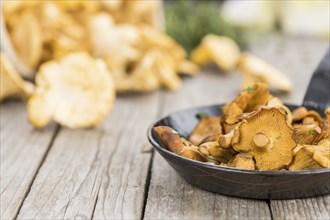 Fresh made Fried Chanterelles on a vintage background as detailed close-up shot