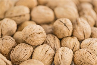 Walnuts on a vintage background as detailed close-up shot (selective focus)