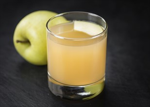 Fresh made Juice (apple) on a vintage background (close-up shot)