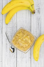 Mashed Bananas on a vintage background as detailed close-up shot (selective focus)