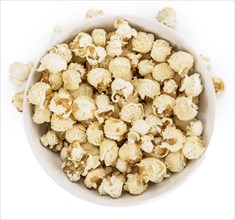 Portion of Popcorn as detailed close-up shot isolated on white background