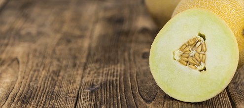 Fresh made Honeydew Melon on a vintage background (close-up shot)