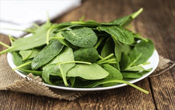 Portion of fresh Spinach as detailed close-up shot (selective focus)