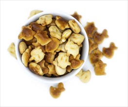 Portion of mixed Snacks isolated on white background (close up shot, selective focus)