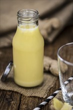 Portion of fresh Ginger Juice (selective focus, close-up shot)