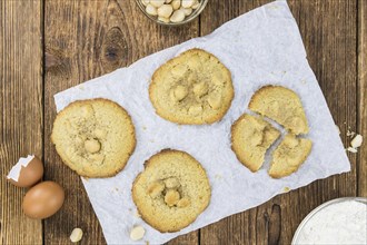 Vintage wooden table with Cookies (selective focus, close-up shot)