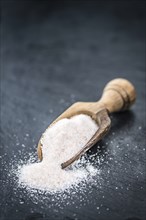 Pink Salt on a vintage background as detailed close-up shot (selective focus)