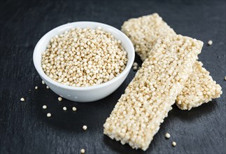 Slate slab with fresh made Quinoa Bars (close-up shot, selective focus)