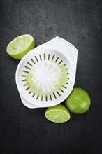 Some Fresh Lime Juice on a slate slab (close-up shot, selective focus)