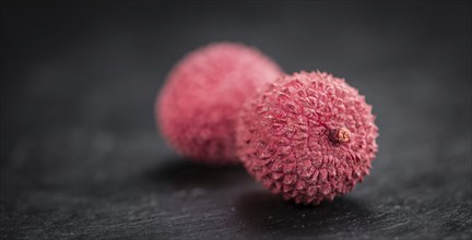 Portion of fresh Lychees (close-up shot, selective focus)