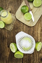 Portion of fresh Lime Juice (close-up shot, selective focus)