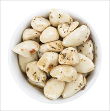 Portion of Preserved Garlic (as close-up shot) isolated on white background