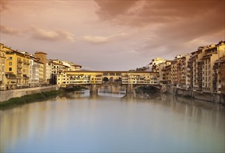 Far view at sunset of Ponte Vecchio in Florence, Italy, Europe