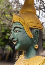 Green-faced guardian statue, Wat Kao Nhot temple, Vientiane, Laos, Asia