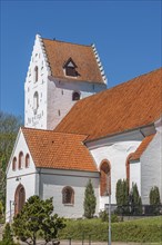 Lindelse Kirke, typical Danish church from 1830, whitewashed, red tiled roof, hill, church tower