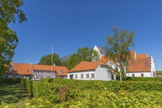 Lindelse Kirke, typical Danish church from 1830, whitewashed, red tiled roof, hill, pastorate,