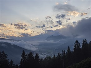 Evening clouds and fog over the Liesingtal, in the valley the village of Traboch, Schoberpass