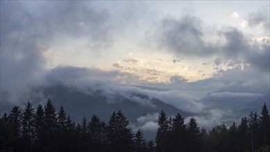 Evening clouds and fog over the Liesingtal, in the valley the village of Traboch, Schoberpass