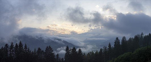 Evening clouds and fog over the Liesingtal, in the valley the village Traboch, Schoberpass federal