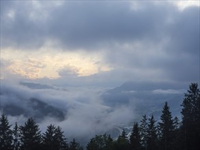 Evening clouds and fog over the Liesingtal, in the valley the village of Traboch, Schoberpass