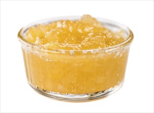 Pineapple Jam isolated on white background, selective focus, close-up shot