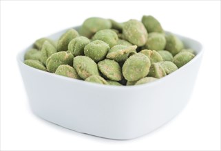 Peanuts (with Wasabi flavor) isolated on white background (selective focus, close-up shot)