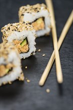 Portion of fresh made Sushi (detailed close-up shot, selective focus)