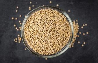 Portion of fresh made Mustard Seeds (close-up shot, selective focus)