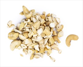 Portion of chopped Cashew nuts isolated on pure white background (detailed close-up shot)