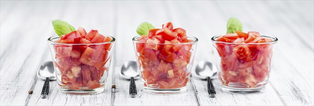 Homemade Cutted Tomatoes on vintage background (selective focus, close-up shot)