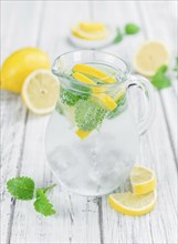 Lemonade on a vintage background as detailed close-up shot (selective focus)