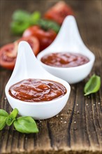 Portion of fresh made Tomato Ketchup (close-up shot, selective focus)