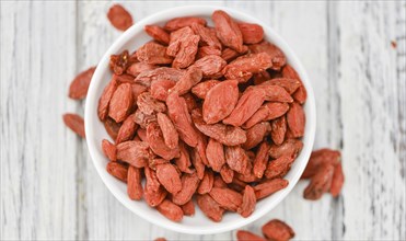 Goji Berries on a vintage background as detailed close-up shot (selective focus)