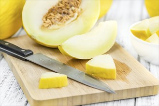 Portion of fresh made Honeydew Melon (close-up shot, selective focus)