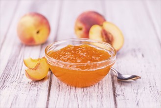 Peach Jam on a vintage background as detailed close-up shot, selective focus