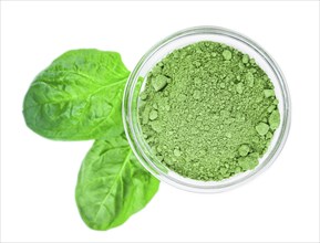 Spinach powder isolated on white background (close up, selective focus)