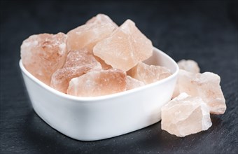 Portion of pink himalayan Salt (detailed close-up shot, selective focus)