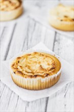 Homemade Cheesecake on vintage background (selective focus, close-up shot)