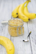 Banana Mash (close-up shot) on a vintage wooden table (selective focus)