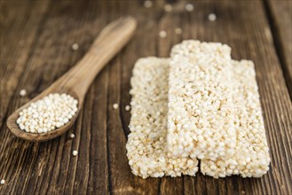 Fresh made Quinoa Bars (selective focus, close-up shot) on an old wooden table